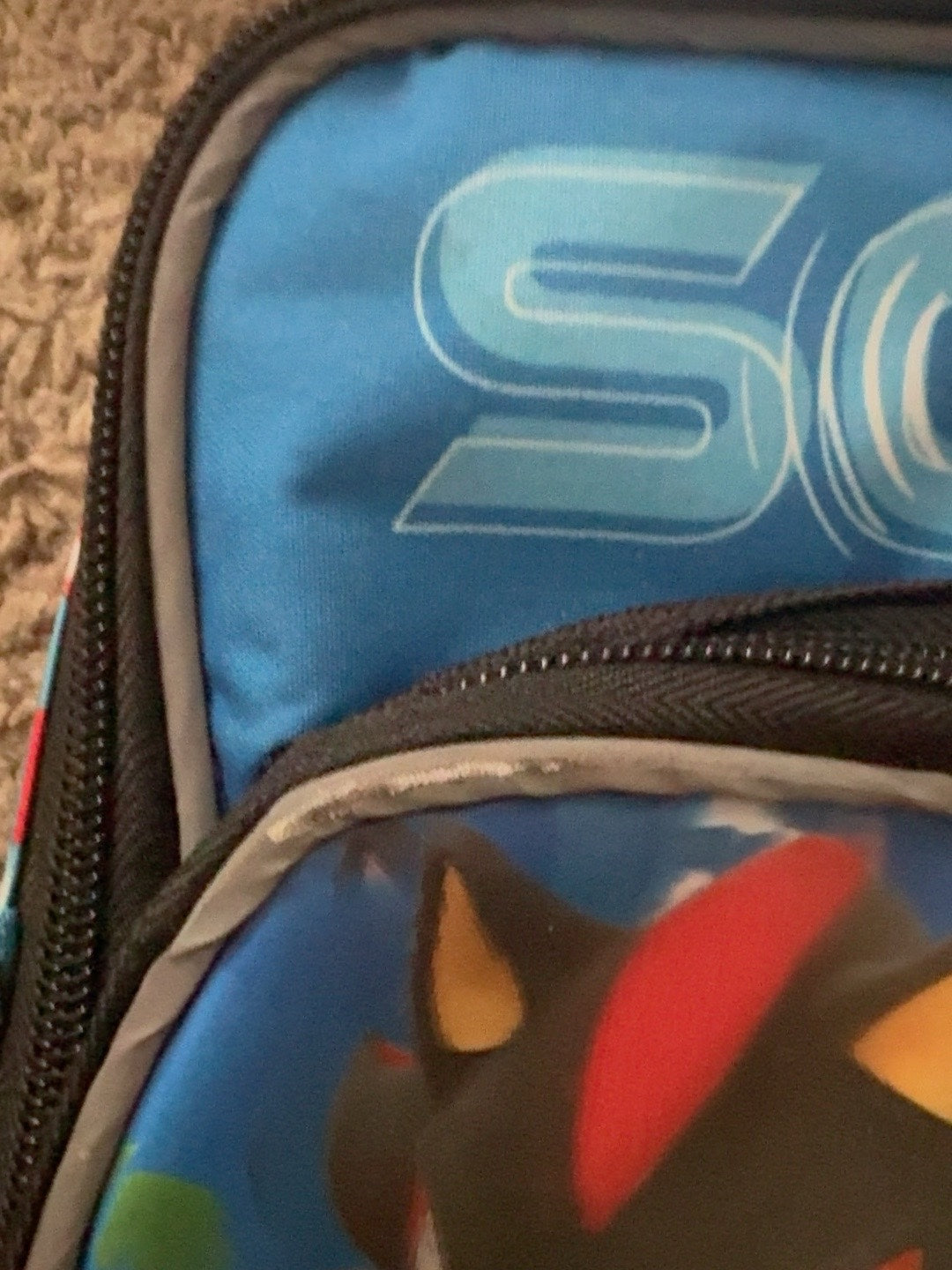 Sonic lunch bag close-up showing wear on trim