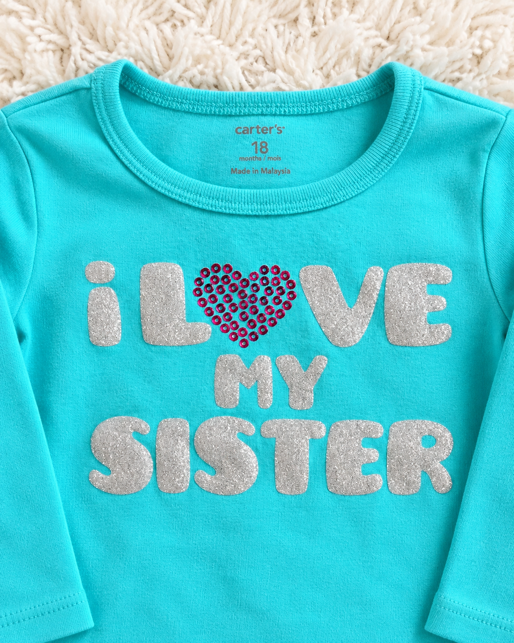 Close-up of Carter's I Love My Sister shirt size 18 months