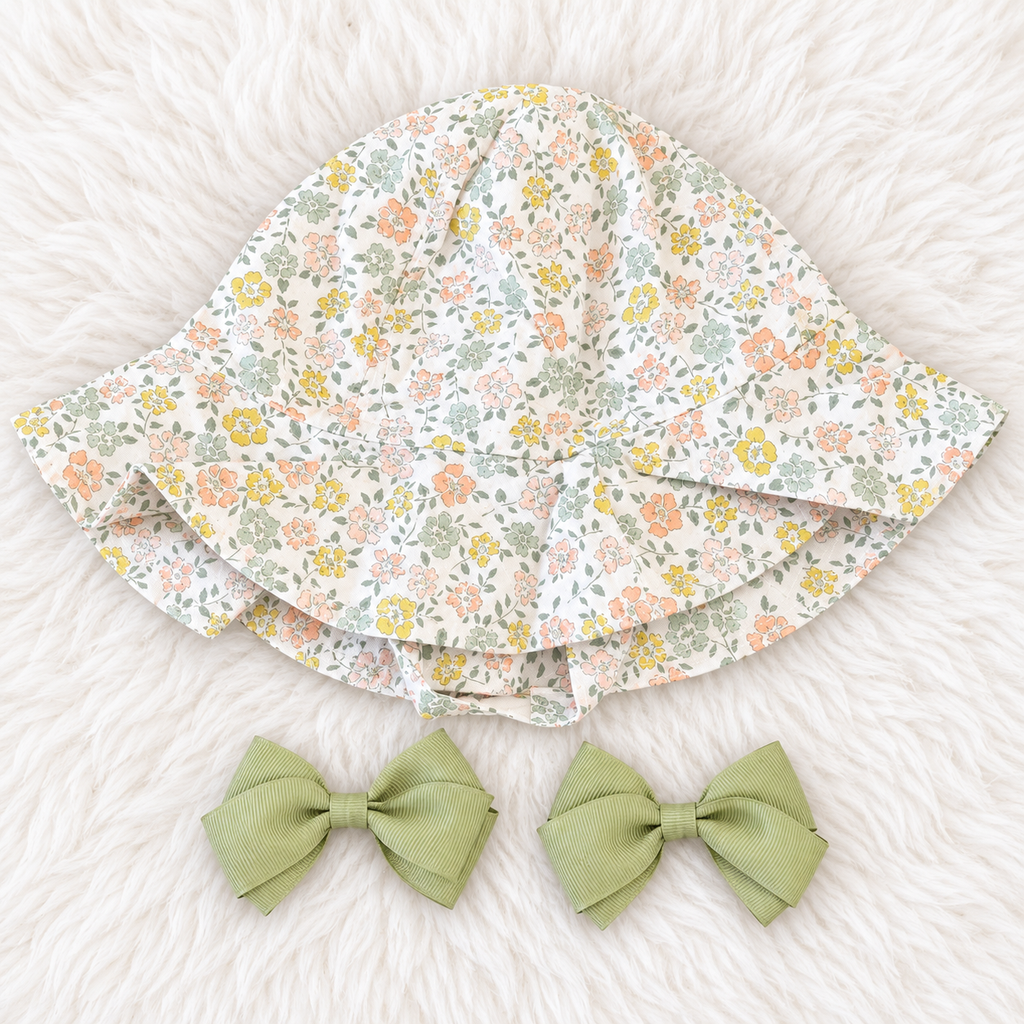 Matching floral sun hat and two sage green bows