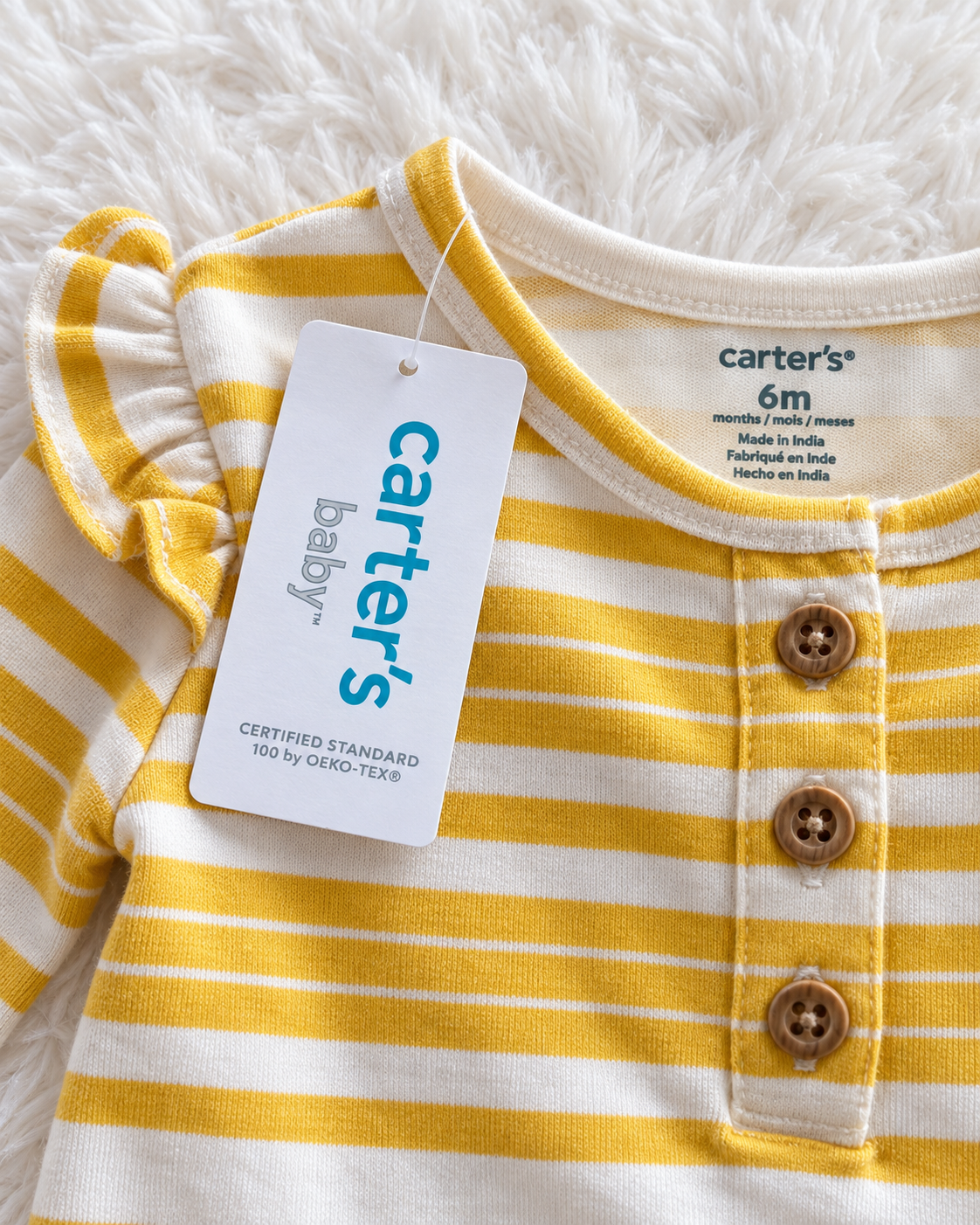 Carter's yellow and white striped bodysuit retail tag detail