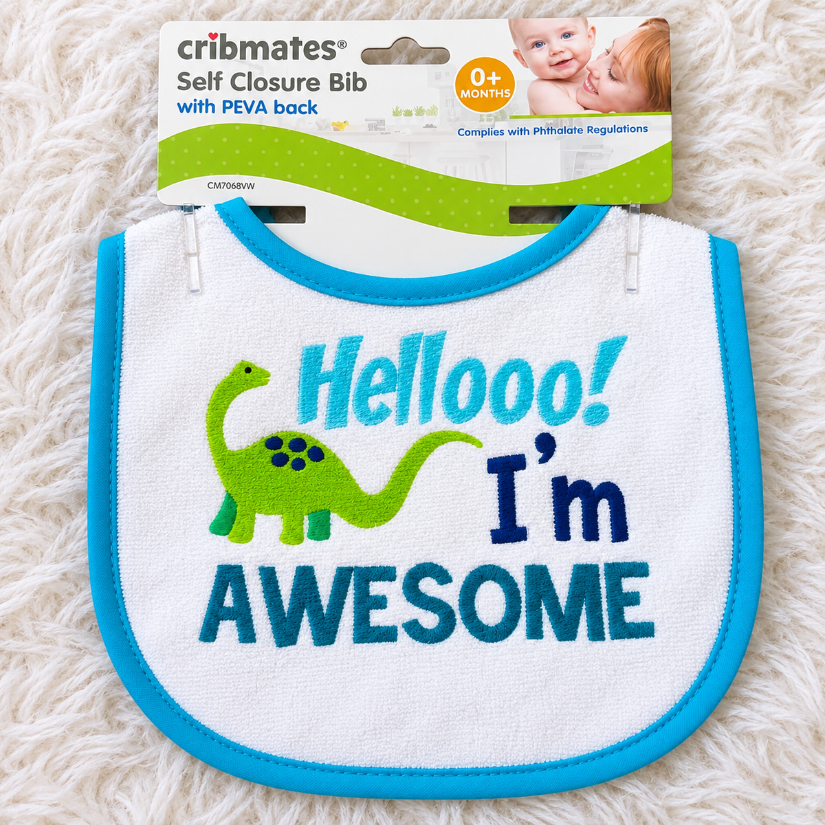 Cribmates Hellooo I'm Awesome baby bib on white rug