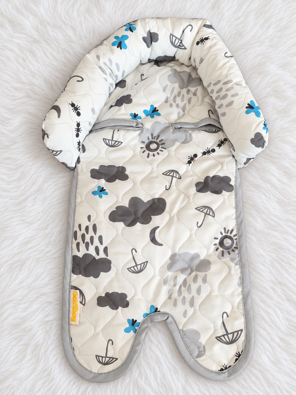 Weather print infant support insert front on white rug