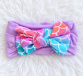 Baby girl mermaid scale bow headband in purple pink and aqua