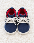 Navy and red baby sneakers front view
