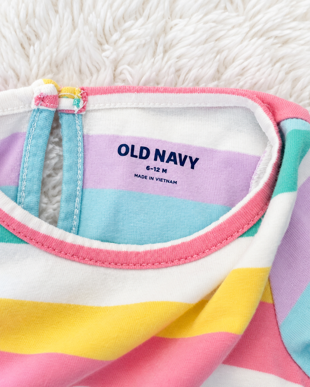 Old Navy 6-12 months size label on pastel rainbow stripe romper