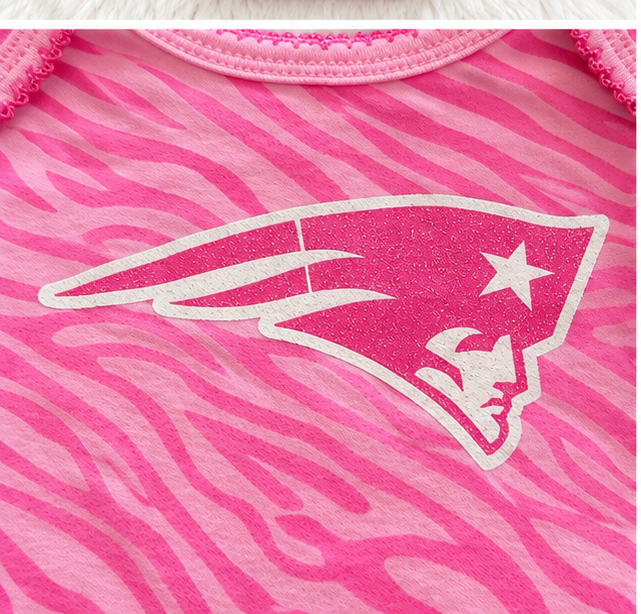 New England Patriots logo detail on pink zebra baby bodysuit