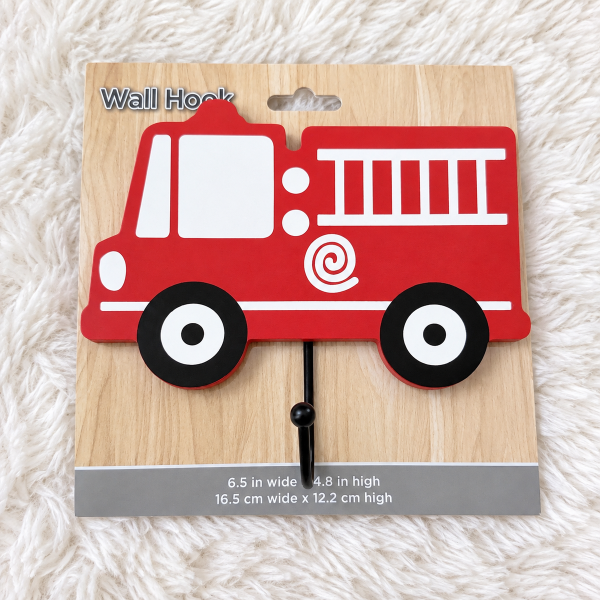 Red fire truck wall hook on white rug