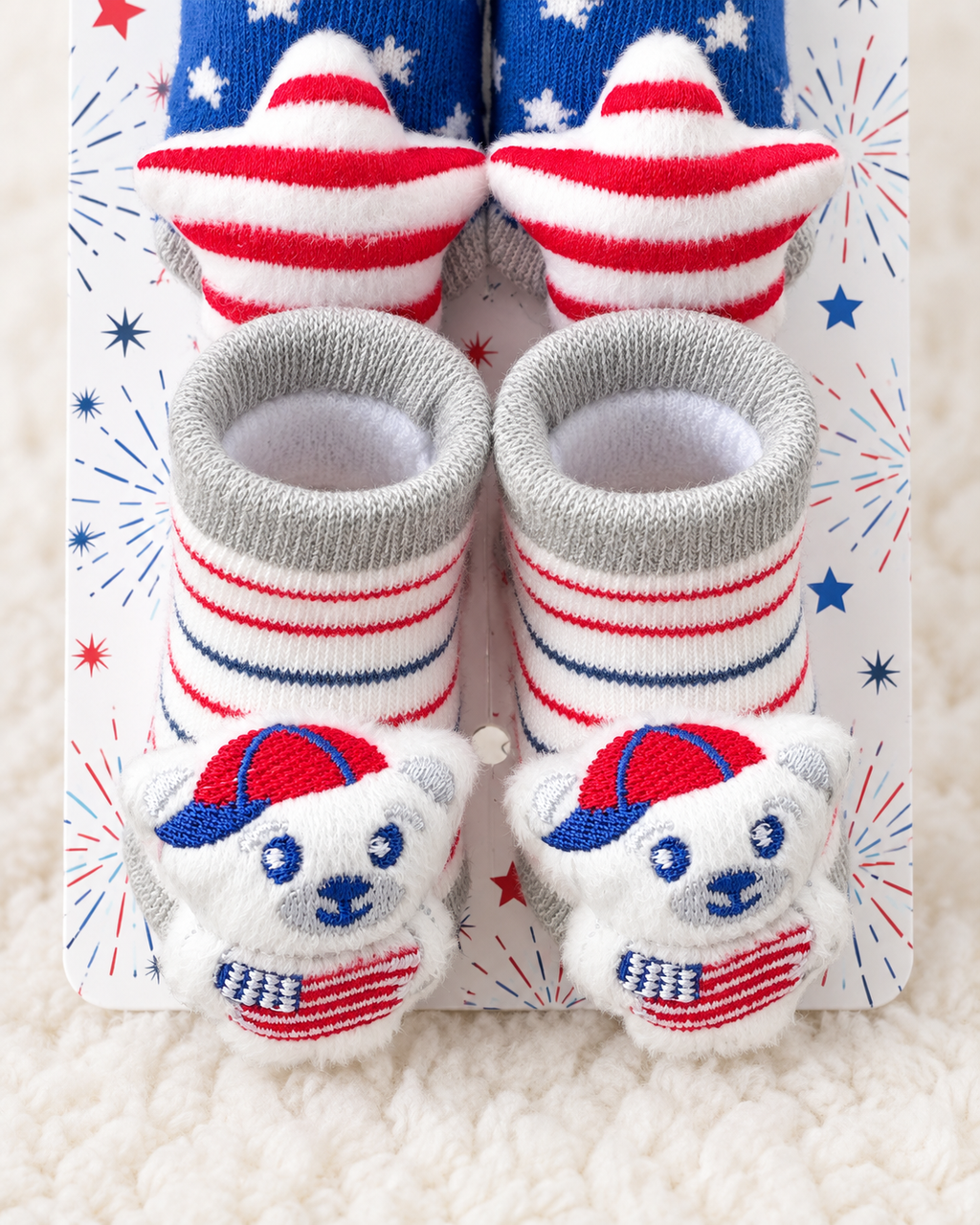 Close-up of striped teddy bear rattle socks