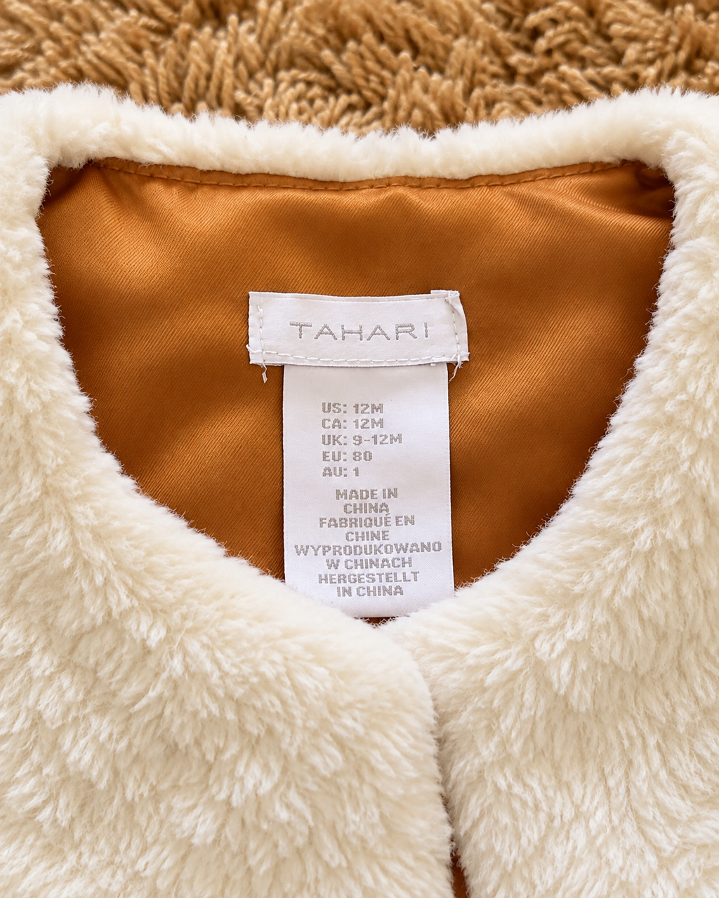 Tahari baby vest size 12 months label close-up